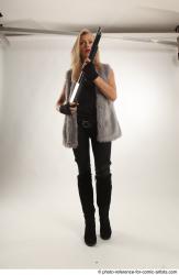 NIKOL STANDING POSE WITH SHOTGUN